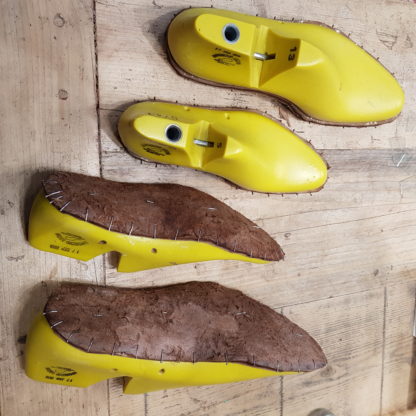 Insoles blocked on lasts ready for shoemaking